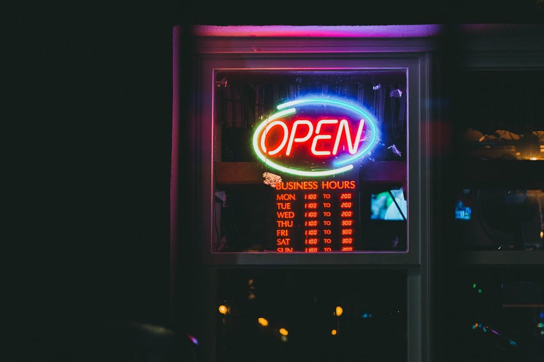 red and blue open neon light signage